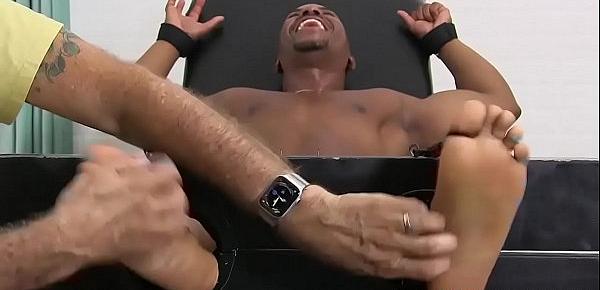  Ebony hunk Rolly restrained for foot fetish domination